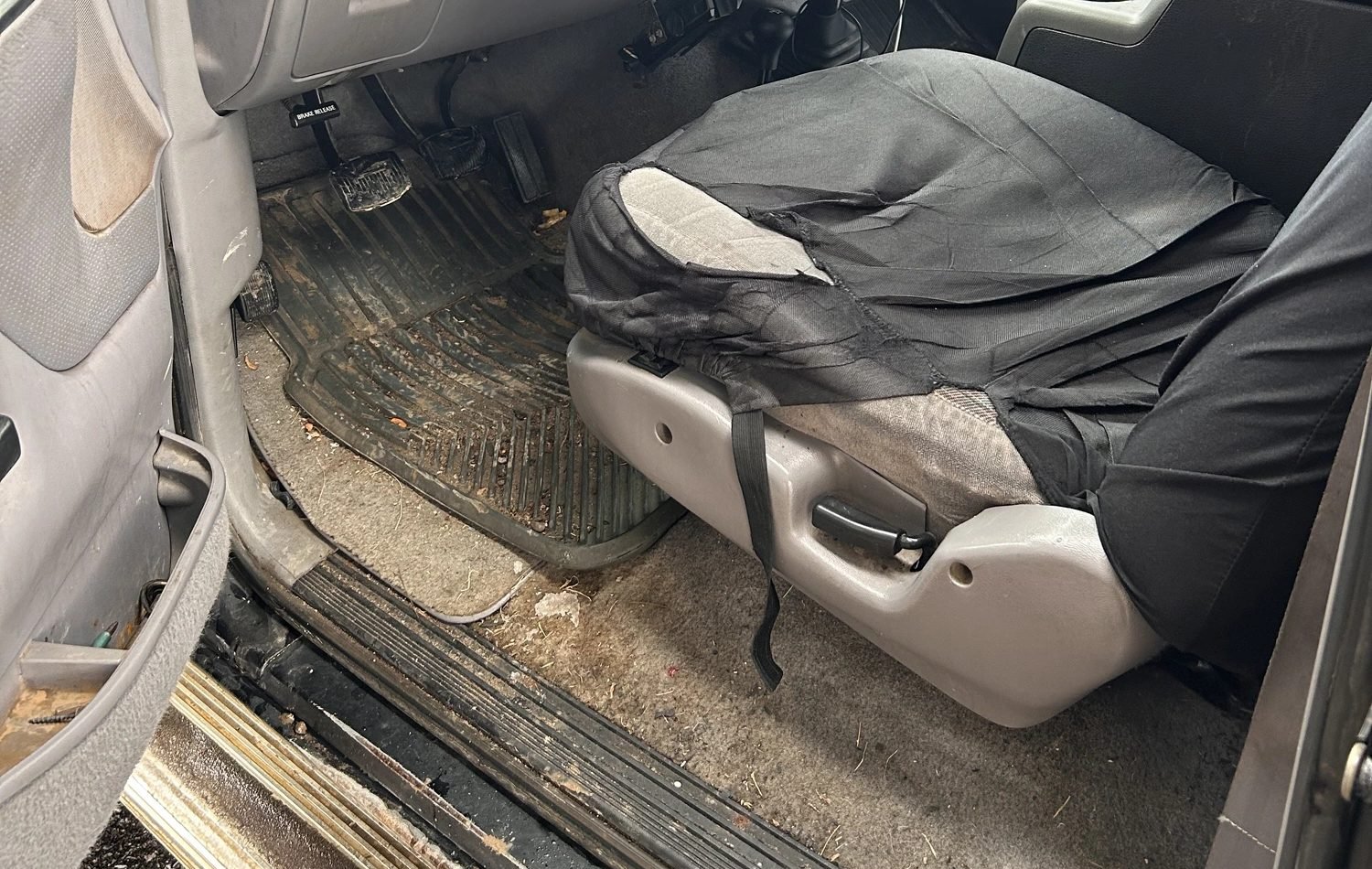 Work truck cabin covered in winter salt and grit before detailing